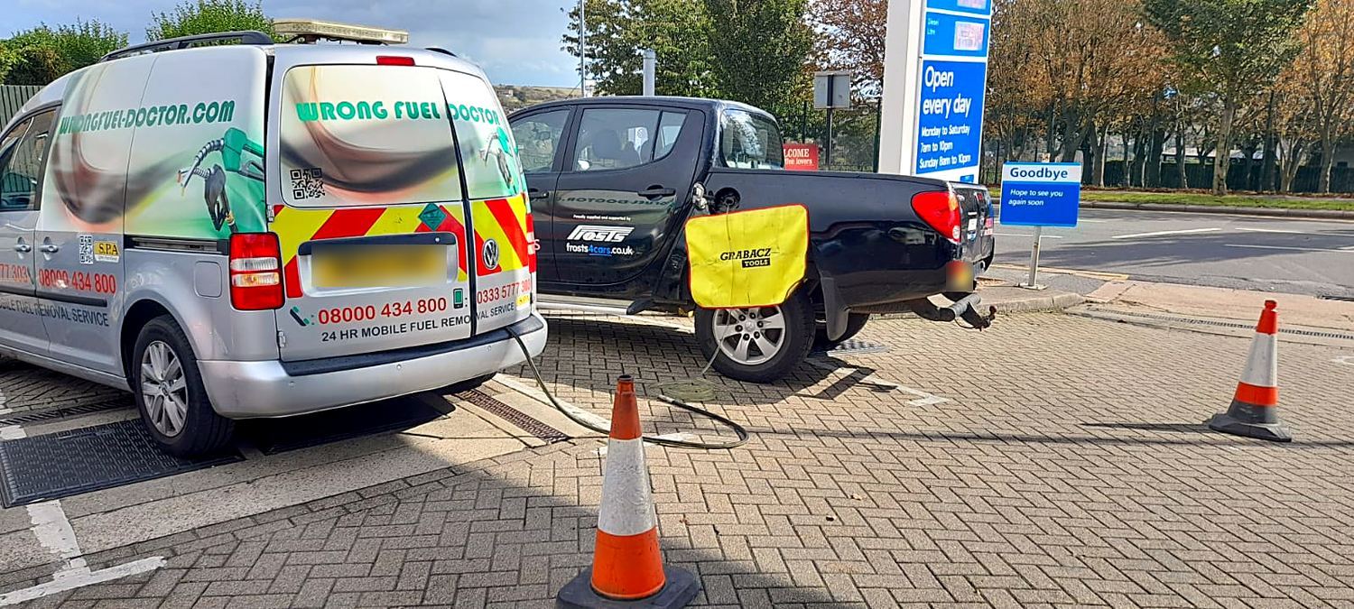 Wrong Fuel Doctor technician draining petrol from a diesel car in Bath Vale